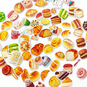 May include: A collection of colourful stickers featuring various baked goods, including cakes, pastries, breads, and cookies. The stickers are perfect for adding a touch of whimsy to planners, journals, and other craft projects.