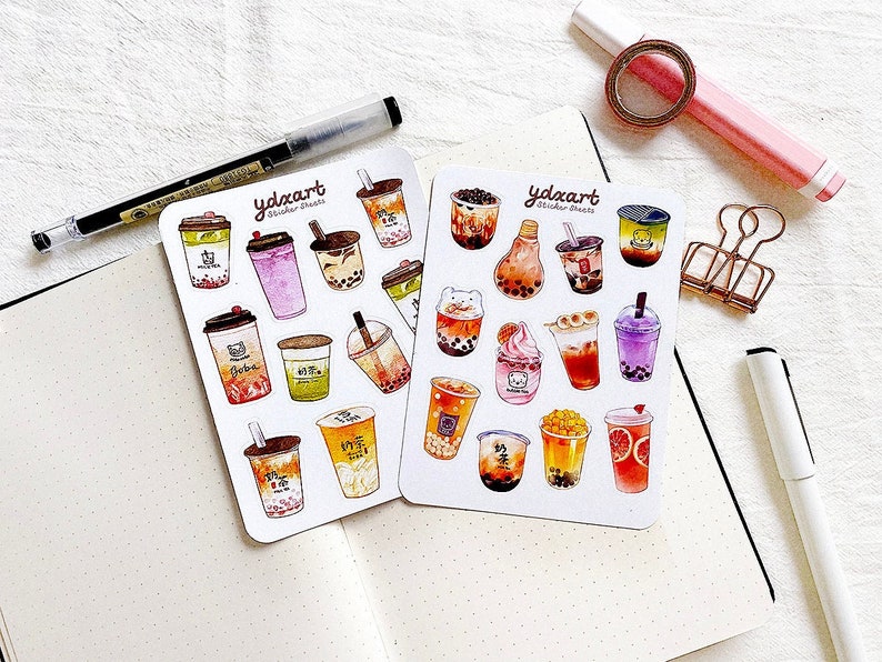 May include: Two sheets of stickers featuring colorful illustrations of bubble tea drinks. The stickers are labeled "ydxart" and "Sticker Sheets".