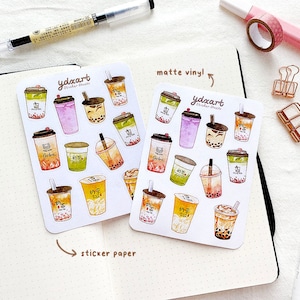 May include: Two sheets of stickers featuring watercolor illustrations of bubble tea cups. The stickers are on white paper with the text "ydxart sticker sheets" and "matte vinyl!" printed on them.