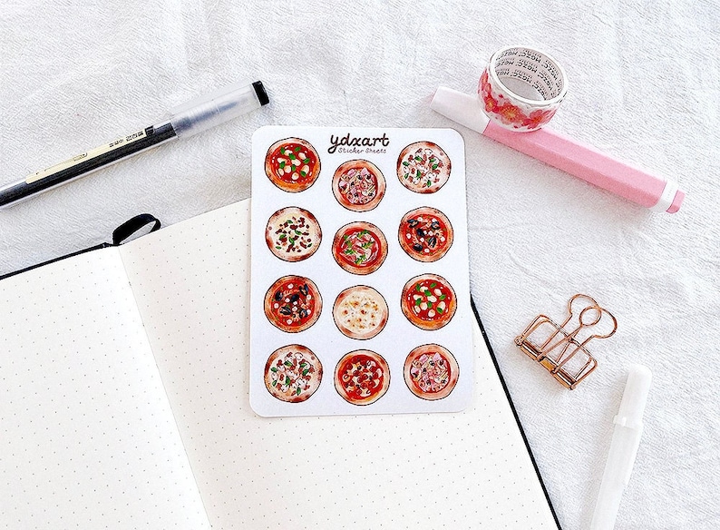 May include: A sheet of 12 pizza sticker sheets with different toppings. The stickers are on a white background with the text "ydzart sticker sheets".