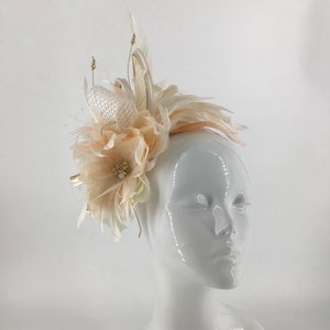 Large Peach, gold and creams birdcage veiling feather fascinator