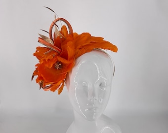 Bright orange feather fascinator