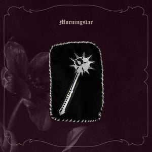 May include: A black patch featuring a white Morningstar weapon design. The patch is edged with white stitching and has the word "Morningstar" above the design. The background is a dark burgundy colour.