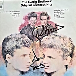 May include: A vintage vinyl record cover featuring a black and white photo of The Everly Brothers. The cover is titled "The Everly Brothers' Original Greatest Hits" and lists songs including "All I Have To Do Is Dream", "'Til I Kissed You", "Let It Be Me", "Problems", "Wake Up Little Susie", "Bye, Bye Love", "Love Of My Life", "Bird Dog", and "and many more".