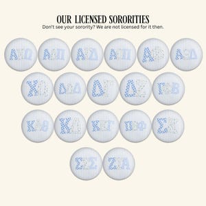 May include: A collection of seventeen circular buttons featuring light blue and white striped backgrounds with various Greek letter combinations in blue and white patterns. Text at the top reads: OUR LICENSED SORORITIES. Don't see your sorority? We are not licensed for it then.