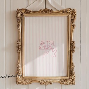 May include: A gold ornate picture frame with a white pinstriped background, hanging against a white wooden wall. The frame is empty, with the text "digital download" in the lower left corner. Pink letters and a ribbon are in the center.