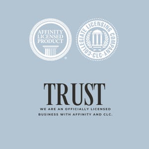 May include: A light blue graphic featuring two circular white seals. The left seal reads AFFINITY LICENSED PRODUCT with a pillar icon. The right seal reads COLLEGIATE LICENSING COMPANY CLC with a building icon. Below, the text reads TRUST WE ARE AN OFFICIALLY LICENSED BUSINESS WITH AFFINITY AND CLC.