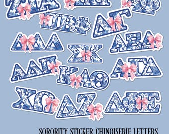 May include: A collection of Greek letter stickers featuring a blue and white chinoiserie floral pattern, each accented with a small pink bow. The text reads SORORITY STICKER CHINOISERIE LETTERS. Choose from 21 Officially Licensed Sororities.
