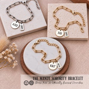 May include: Three link chain bracelets with lobster clasps and extender chains. One silver-tone bracelet features round and rectangular charms with AXΩ and 1885. Two gold-tone bracelets feature charms with ΧΩ and 1895, and KΚΓ and 1870.