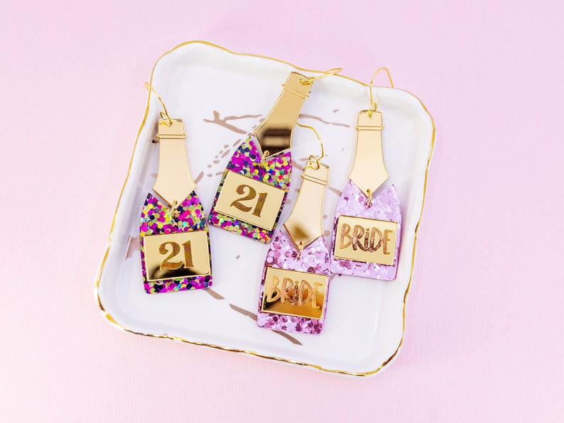 Customizable Champagne Bottle Birthday Earrings", "Personalized Party Earrings", "Glittery Statement Earrings", "Bride-to-be Earrings", "Novelty Birthday Jewelry"