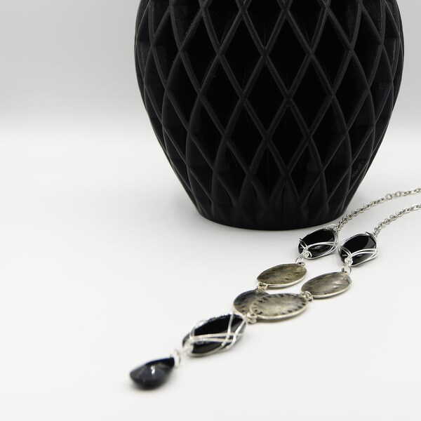 Ranking by Just Jewels Designs- a long black and oval silver-plated with chain necklace set.