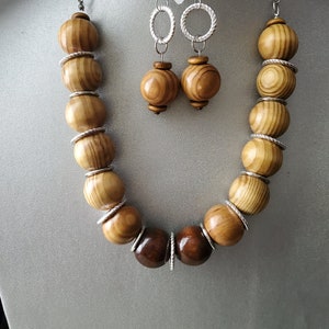 JJD &quot;Coppice&quot; A 25mm wood ball necklace set.  These large round wood balls are of various designs and  shades with silver-tone circle hoops,