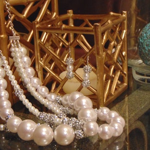 Just Jewels Designs - pearls and more on three strands with variable compilation of beads.