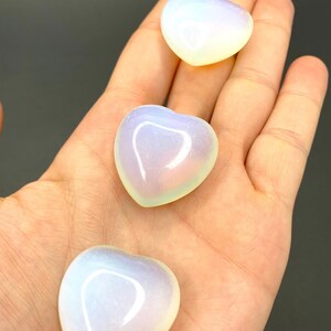 Three heart shaped blue and white opalite stones