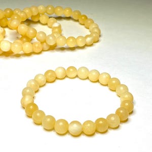 Orange Calcite Crystal Bracelet: Matte Gemstone Bead Stretch Bracelet