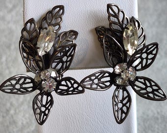 Kramer signed aged bronze filigree rhinestone figural flower  1 x 1.75 inch clip on earrings ear clips