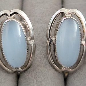 Silver tone light blue cabochon screw back earrings