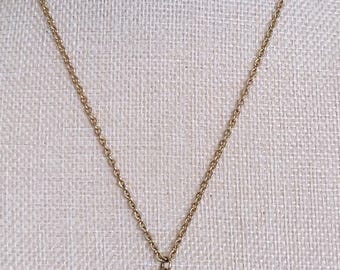 18 inch Sarah Coventry gold tone chain with an apple pendant necklace