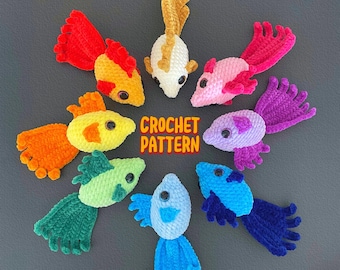 May include: A collection of colorful, crocheted fish arranged in a circle. The fish are in various colors, including red, orange, yellow, green, blue, purple, pink, and white. Each fish has a black eye and a unique tail design. The text "CROCHET PATTERN" is in the center.