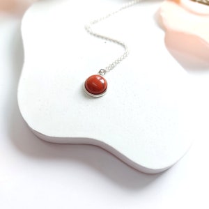 Chain of red jasper gemstone cabochon pendant