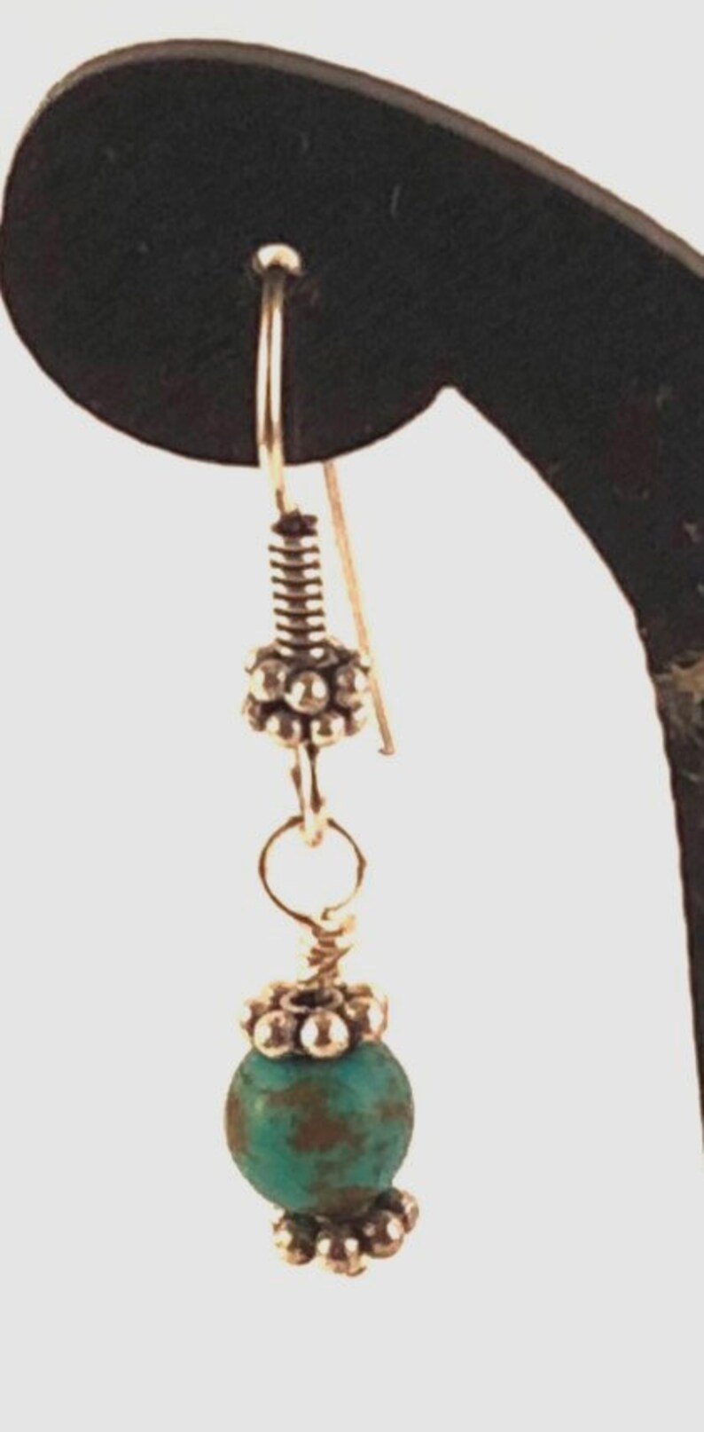 Blue Turquoise Pendant Wire Wrapped to a Necklace of Turquoise Beads Separated by Silver Daisy Spacers with Matching Earrings