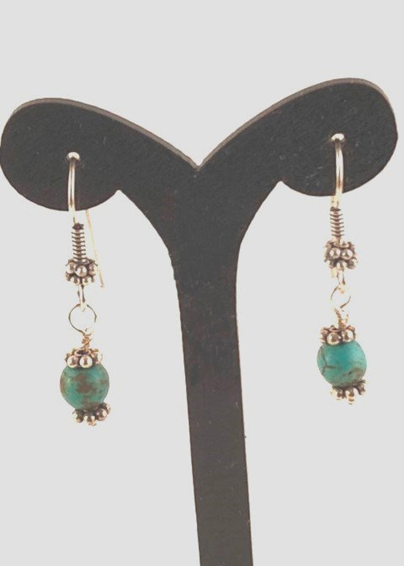Blue Turquoise Pendant Wire Wrapped to a Necklace of Turquoise Beads Separated by Silver Daisy Spacers with Matching Earrings