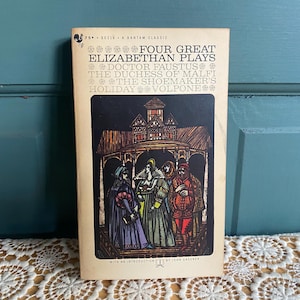 May include: A vintage paperback book titled "Four Great Elizabethan Plays." The cover features a black and brown illustration of costumed figures under an arched structure. The book's title and author's names are printed in white.