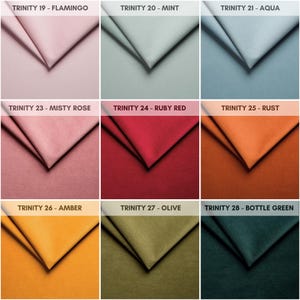 May include: Nine fabric swatches in a variety of colours, including flamingo, mint, aqua, misty rose, ruby red, rust, amber, olive, and bottle green. Each swatch is labelled with its colour name and a Trinity number.