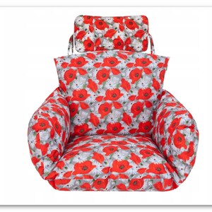 May include: Red and white floral chair cushion with a matching headrest. The cushion has a poppy and daisy print.