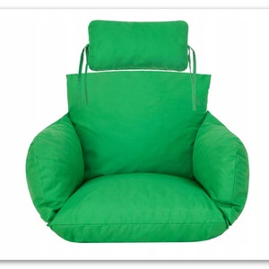 May include: A green chair cushion with a matching green back cushion. The cushion has a rounded shape and is designed for outdoor use.