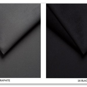 May include: Two fabric swatches, one in graphite and one in black. The swatches are folded in a triangular shape. The swatches are labeled with the numbers 15 and 16 and the words "Graphite" and "Black".