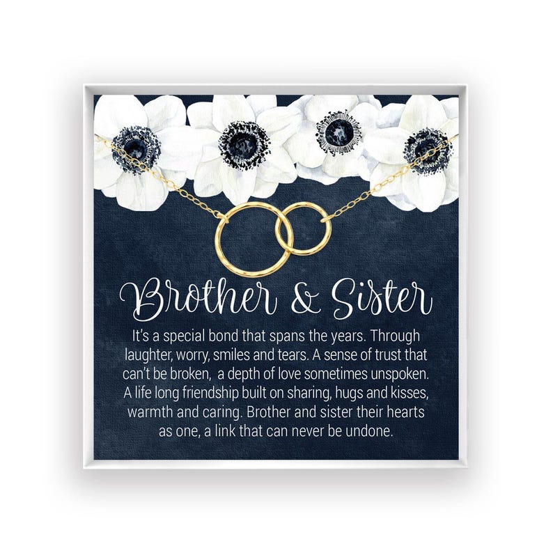 The image is a framed print with a black background and white flowers. The text on the print reads "Brother & Sister" and provides a heartfelt message about the special bond between siblings, expressing trust, love, and the importance of sharing and caring for one another.
