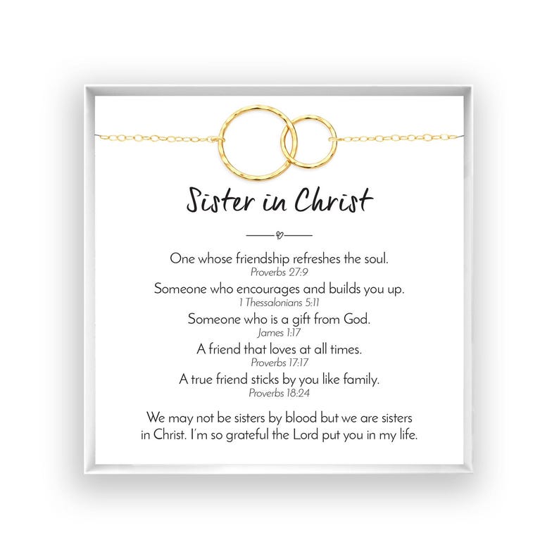 The image is a framed print with a religious message about sisters in Christ.