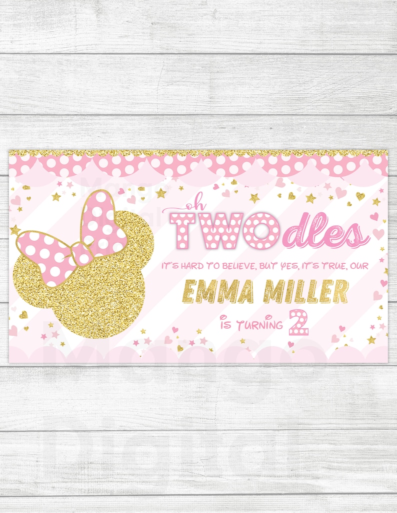 May include: Pink and gold birthday banner with a Minnie Mouse head, polka dots, and stars. The text reads "Oh Two-dles It's hard to believe, but yes, it's true, our Emma Miller is turning 2."