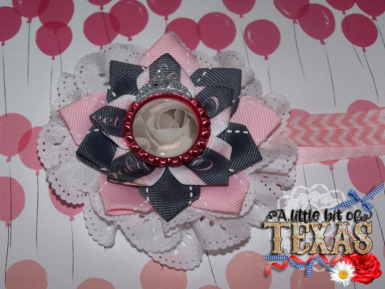Beautiful Eyelet Flower with 3 layer bow on top with bottle cap image