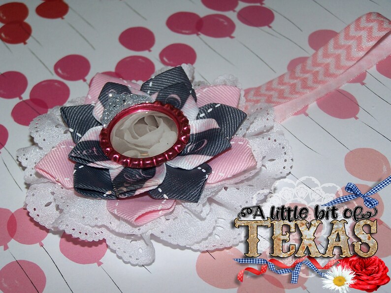 Beautiful Eyelet Flower with 3 layer bow on top with bottle cap image