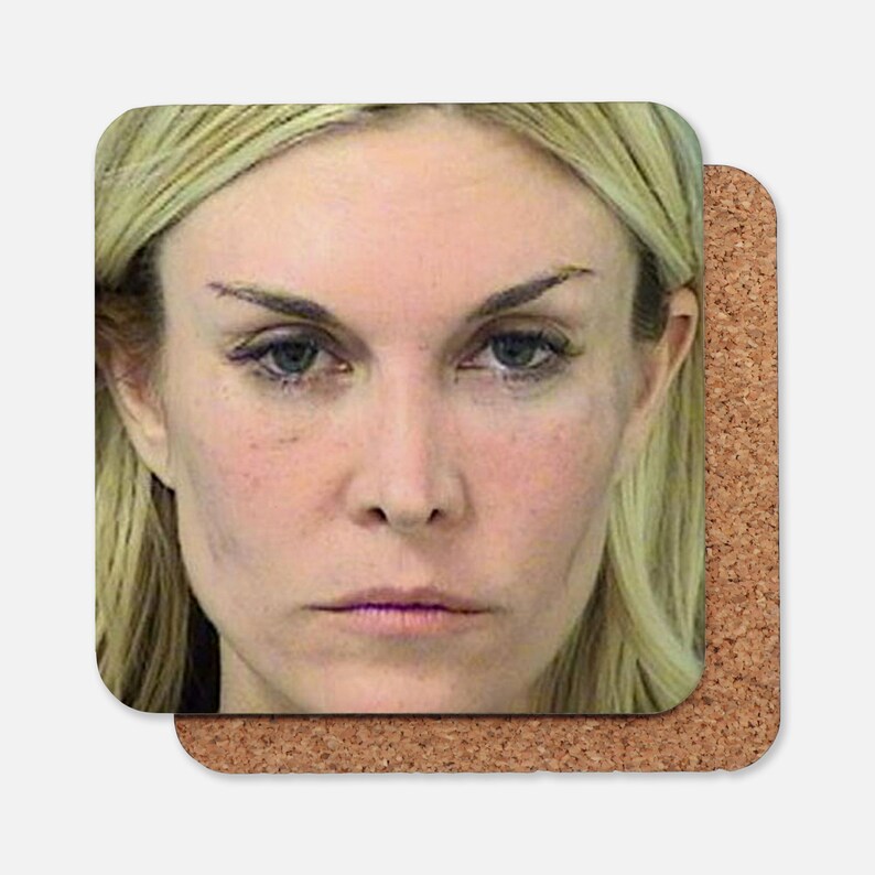 May include: A close-up portrait of a woman with blonde hair. She is looking directly at the camera with a serious expression. Her eyebrows are dark and defined.