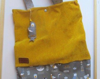 Bag made of soft mustard yellow cord fabric in combination with a cotton fabric with seagulls, push button and felt handles, dimensions see description