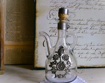 Old oil bottle, olive oil with metal application, shabby, serving, decoration