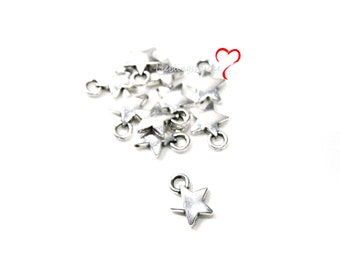 May include: A pile of silver star-shaped charms with a jump ring for attaching to jewelry or crafts.