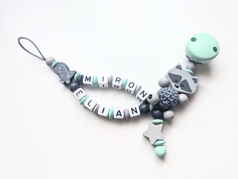 Schnullerkette Doppelname Waschbär mit Dino