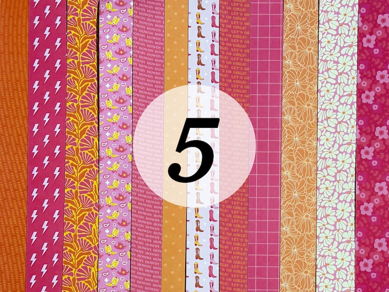 May include: A set of five patterned washi tapes. The tapes feature a variety of designs, including lightning bolts, floral patterns, and geometric shapes. The tapes are all in shades of pink, orange, and white.