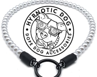 May include: A pet collar featuring a strand of white spherical beads connected by black cylindrical end caps to a central black metal O-ring. A circular logo in the center displays a dog wearing glasses with the text HYPNOTIC DOG DOPE DOG ACCESSORIES.