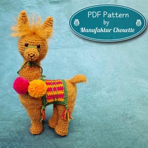 May include: A crocheted llama toy in shades of brown, with a colorful saddle and pom-poms. The llama has a green halter and a fluffy mane. The image includes a teal oval with the text "PDF Pattern by Manufaktur Chouette."