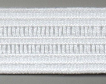 May include: White elastic trim with a textured pattern. The trim has a woven look and is made of a soft, flexible material.