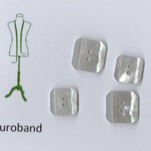 May include: Four white, square-shaped buttons with two holes each. The buttons are made of a pearlescent material and have a slightly iridescent sheen. The buttons are arranged in a semi-circle on a white background. The text "Euroband" is printed in green below the buttons.