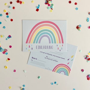 May include: A rainbow-themed invitation card with the text "EINLADUNG" and "wete gib mir Bescheid, ob du kommen kannst."  The card also includes the text "Dein/e", "P.S.", "Tel", and "Ich freue mich auf Dich!"  The card has a rainbow design with raindrops and the text "BASENGWASEN".