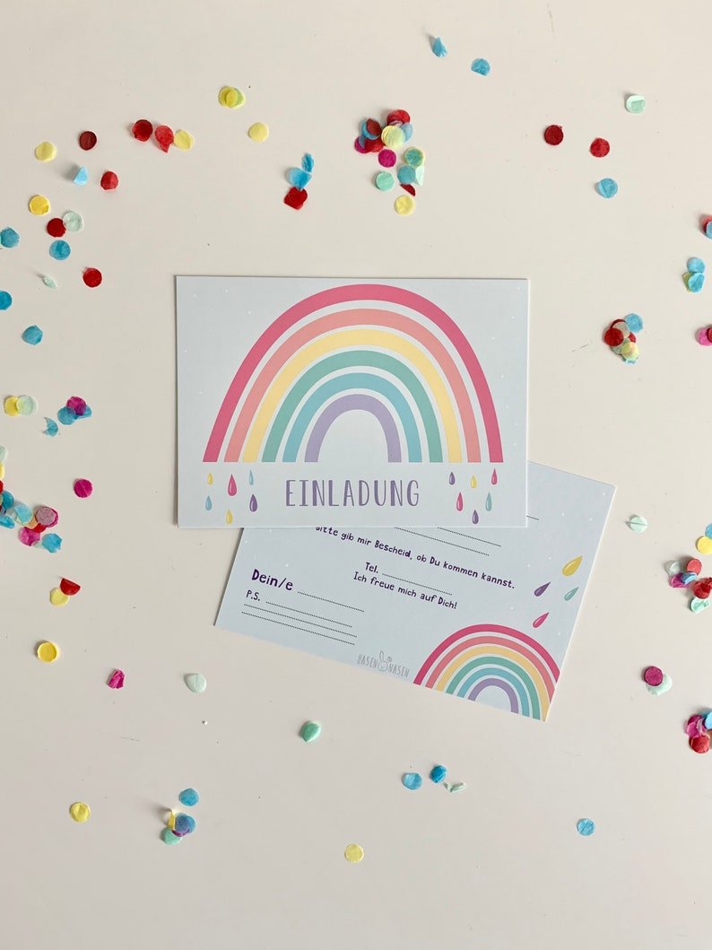 May include: A rainbow-themed invitation card with the text "EINLADUNG" and "wete gib mir Bescheid, ob du kommen kannst."  The card also includes the text "Dein/e", "P.S.", "Tel", and "Ich freue mich auf Dich!"  The card has a rainbow design with raindrops and the text "BASENGWASEN".