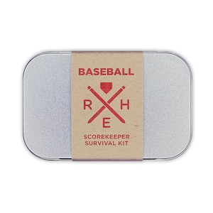 May include: A silver metal tin with a brown paper label that says "BASEBALL SCOREKEEPER SURVIVAL KIT". The label also has a red baseball bat and ball graphic with the letters "R", "H", and "E" in red.