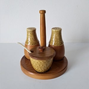 wood and ceramics spice rack vintage kitchen salt and pepper shaker wooden salt shaker, and wooden kitchen utensils